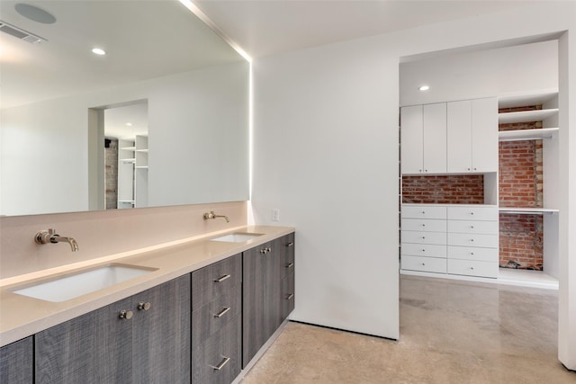 bathroom featuring vanity and concrete floors