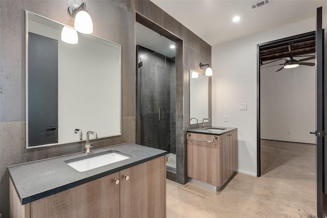 bathroom with ceiling fan, vanity, concrete floors, and a shower with shower door