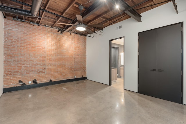 interior space with ceiling fan and wood ceiling