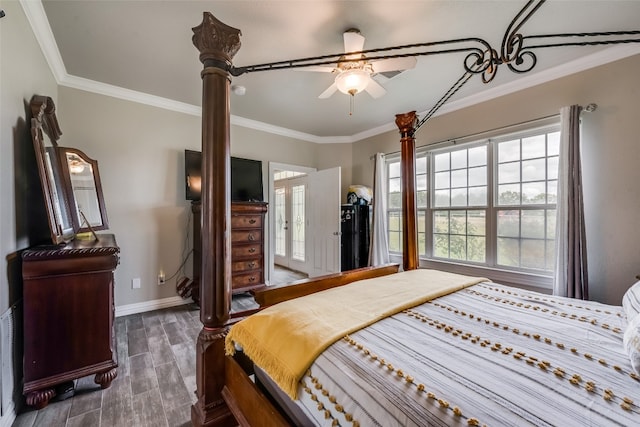 bedroom featuring ornamental molding, ceiling fan, dark wood-type flooring, and french doors