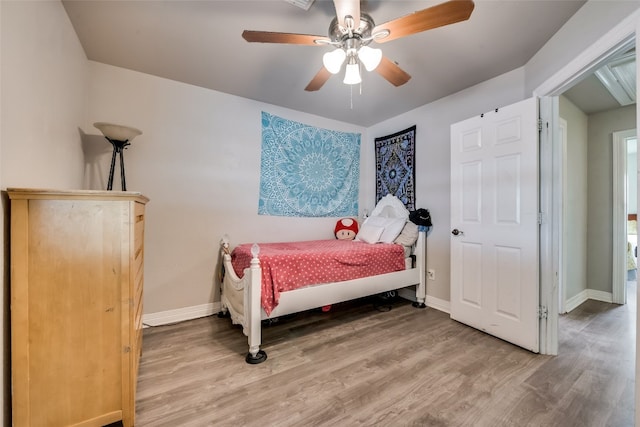 bedroom featuring wood-type flooring and ceiling fan