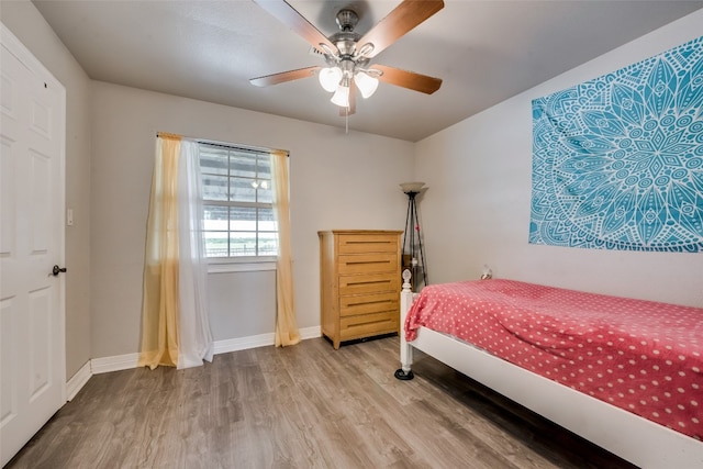 bedroom featuring wood-type flooring and ceiling fan