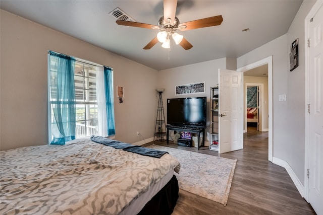 bedroom featuring dark wood-type flooring and ceiling fan