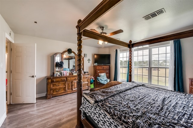 bedroom featuring ceiling fan and hardwood / wood-style floors