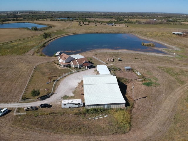 bird's eye view featuring a rural view and a water view