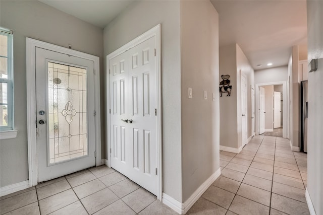 foyer featuring light tile patterned floors