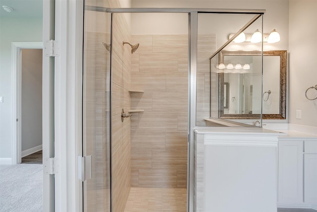 bathroom with a shower with shower door