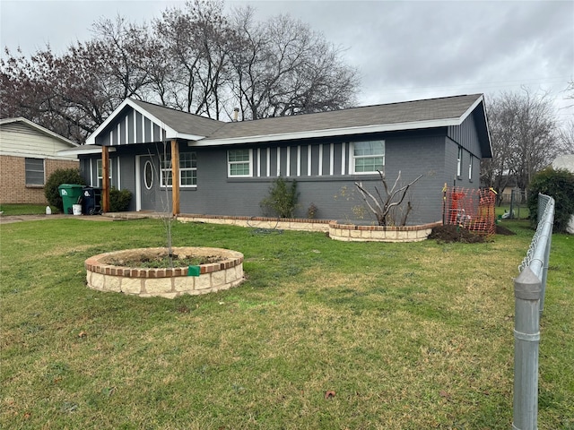 ranch-style house with a front lawn