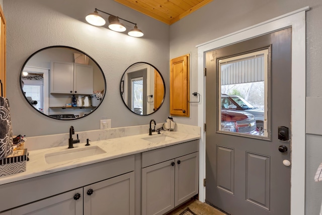 bathroom with vanity and wooden ceiling