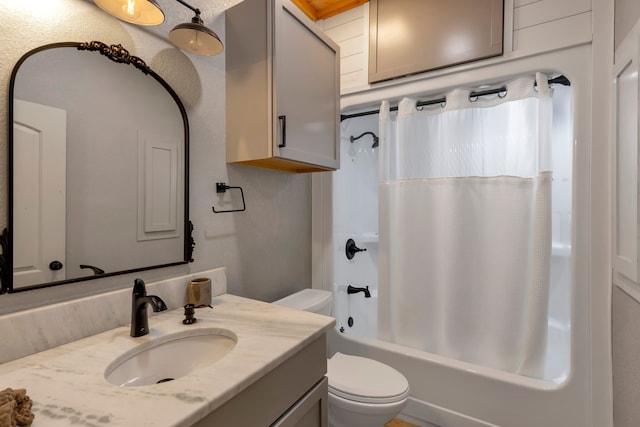 full bathroom featuring shower / tub combo, vanity, and toilet