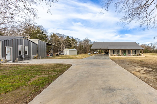 view of yard with a shed and covered porch