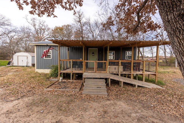 manufactured / mobile home with a storage shed and a wooden deck