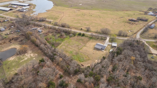 drone / aerial view featuring a water view and a rural view