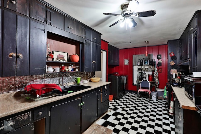 kitchen with ceiling fan, washing machine and clothes dryer, tile patterned floors, and light countertops