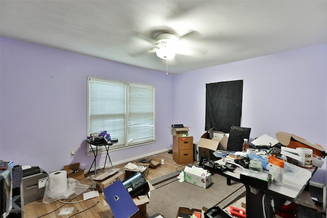 office space with wood finished floors and ceiling fan