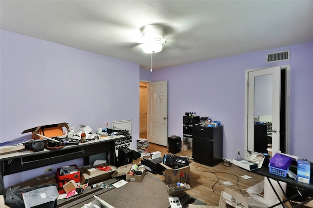 interior space featuring ceiling fan and wood-type flooring