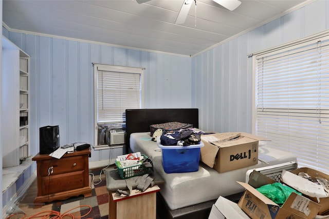 bedroom with ceiling fan and crown molding