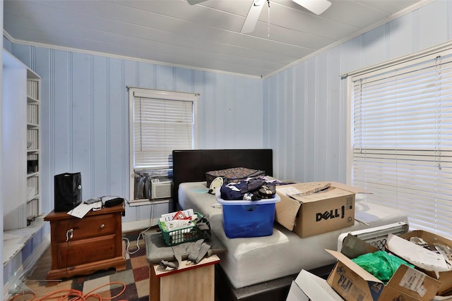 bedroom featuring a ceiling fan, cooling unit, and crown molding