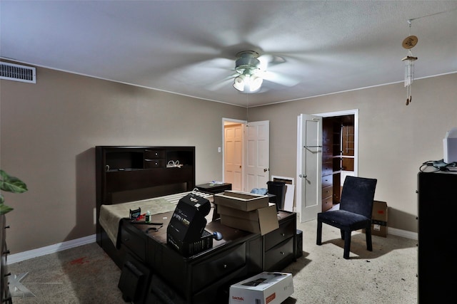 office area with ceiling fan and carpet flooring