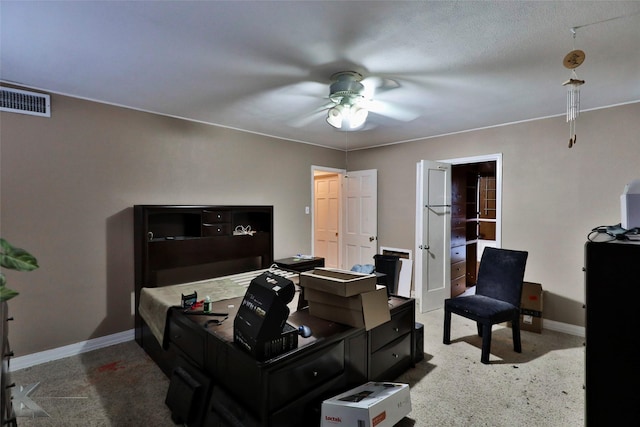 home office with a ceiling fan, visible vents, carpet, and baseboards