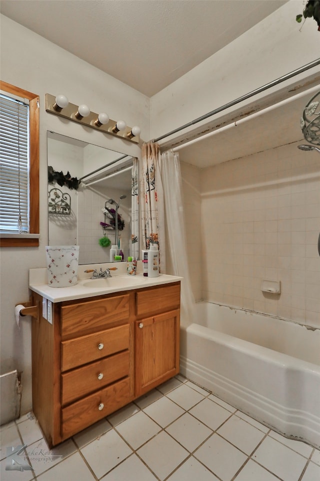 bathroom with tile patterned flooring, shower / bath combination with curtain, and vanity