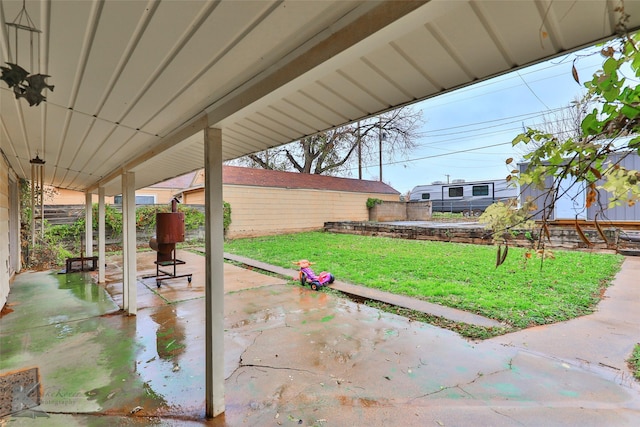 view of patio featuring fence