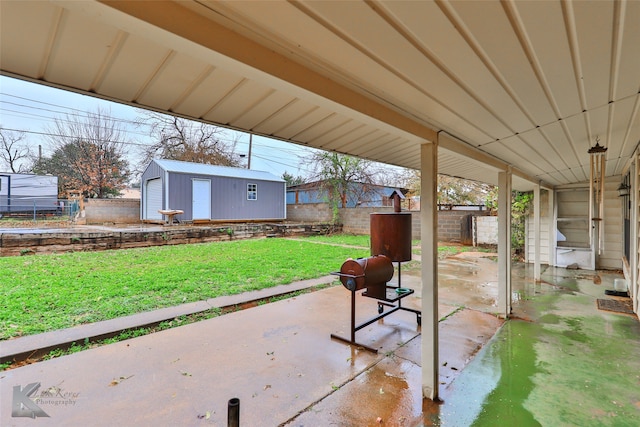 view of patio featuring a storage shed