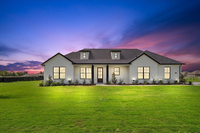 modern farmhouse style home featuring a yard