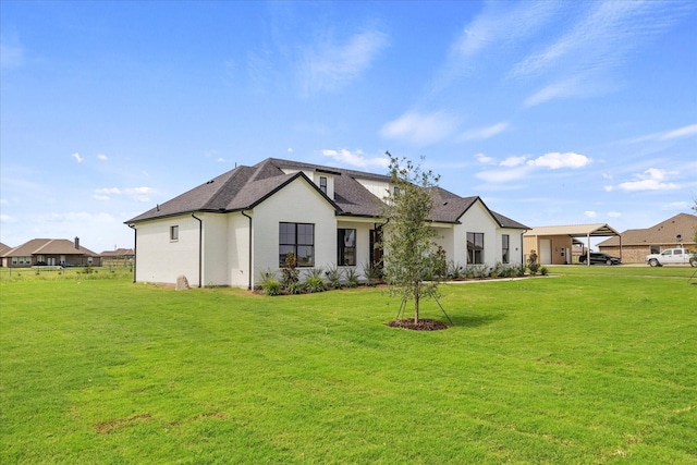 rear view of house with a lawn