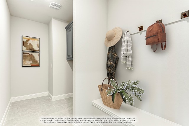 mudroom featuring light tile flooring