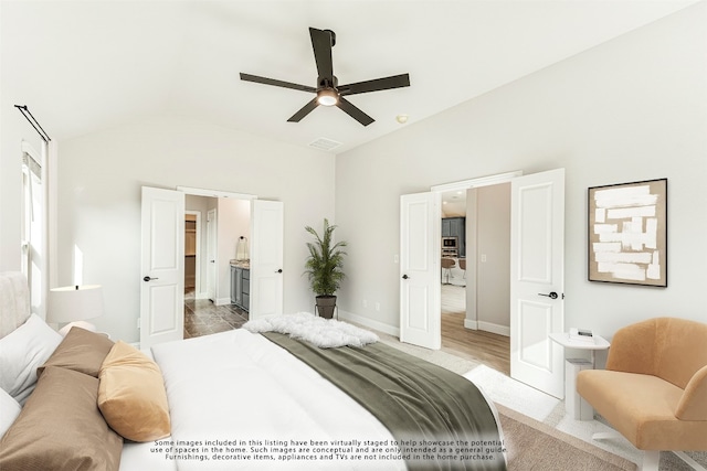 bedroom with light tile floors, lofted ceiling, and ceiling fan