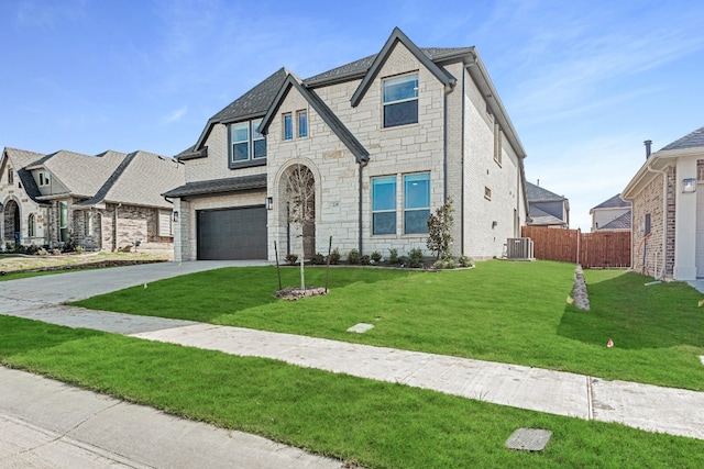 view of front of house featuring a front lawn and a garage