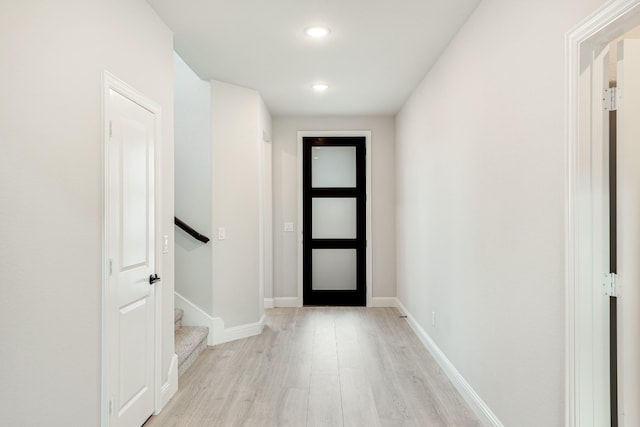 entryway with light hardwood / wood-style floors