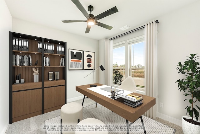 office with light colored carpet and ceiling fan