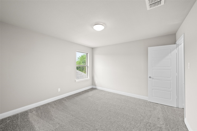 spare room featuring carpet floors