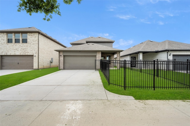 view of front of home with a garage and a front yard