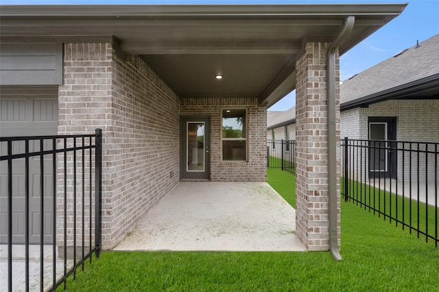 doorway to property featuring a lawn