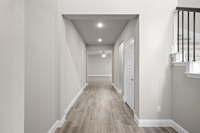 corridor featuring wood-type flooring