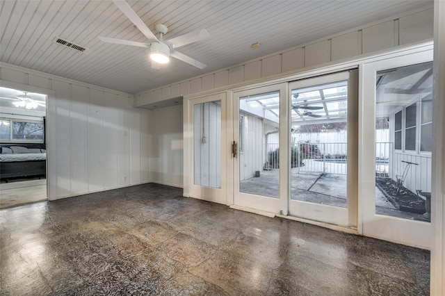 empty room with ceiling fan and wood ceiling