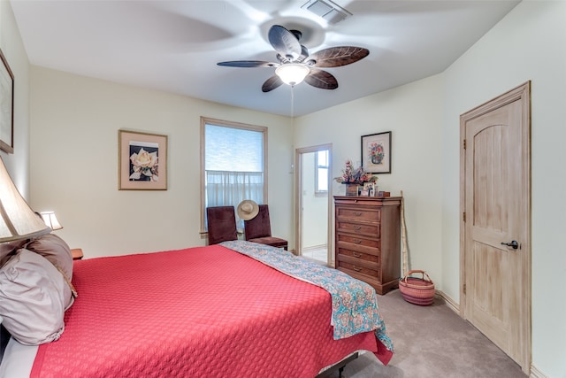 bedroom with ceiling fan and light colored carpet