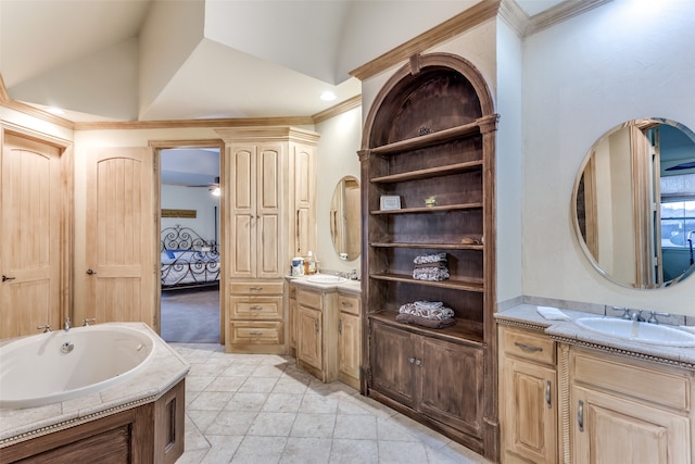 bathroom with vanity, vaulted ceiling, ceiling fan, and a tub