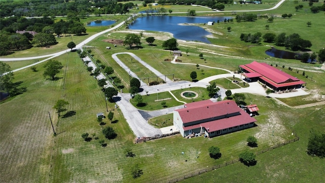 drone / aerial view featuring a water view and a rural view