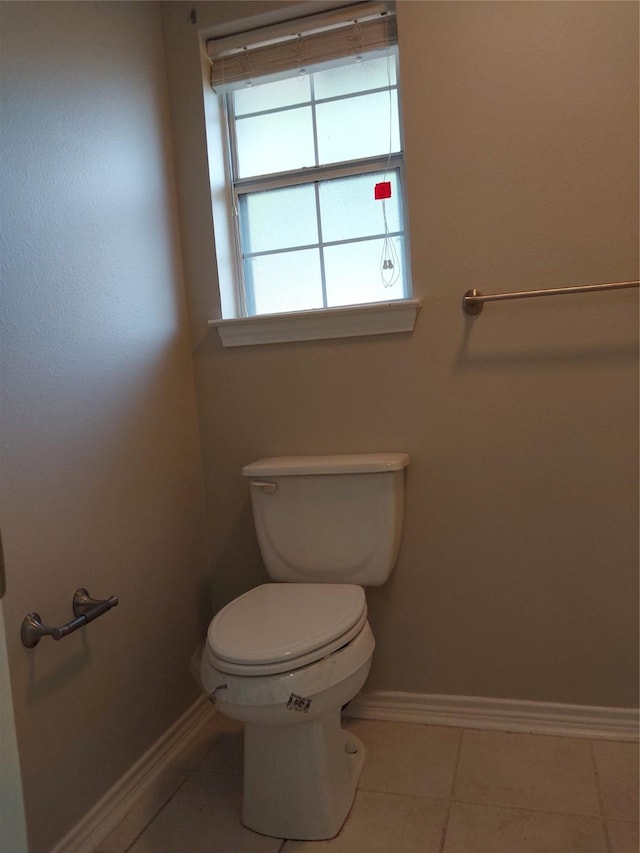 bathroom featuring toilet and tile patterned floors