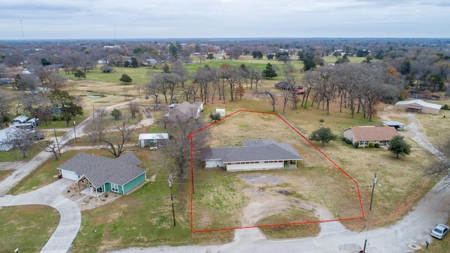 birds eye view of property with a rural view