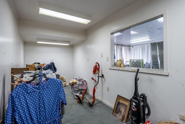 interior space with carpet flooring and baseboards