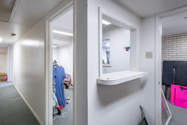 hallway featuring baseboards