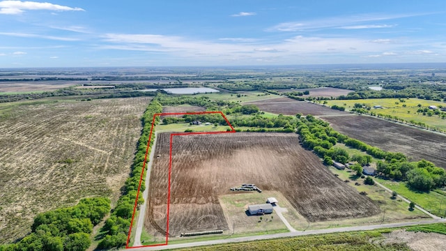 birds eye view of property with a rural view