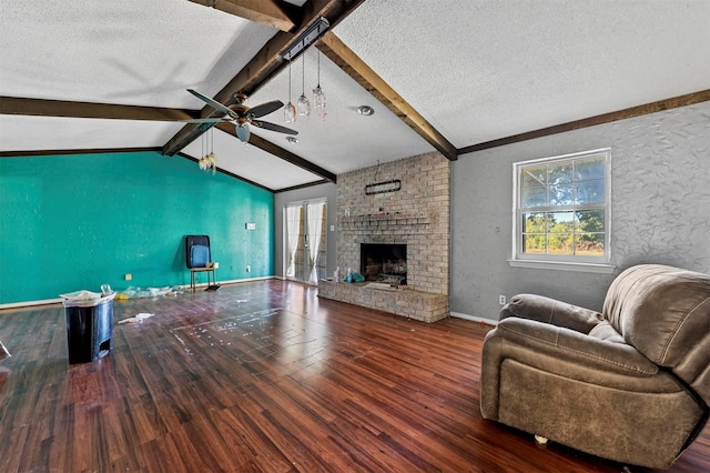 living room featuring a fireplace, lofted ceiling with beams, hardwood / wood-style floors, and ceiling fan