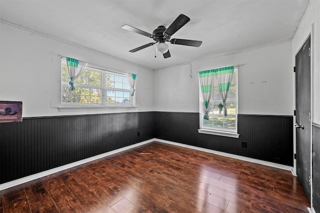 unfurnished room with hardwood / wood-style floors, ceiling fan, and plenty of natural light