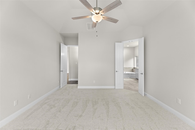 unfurnished bedroom featuring ceiling fan, light carpet, and lofted ceiling